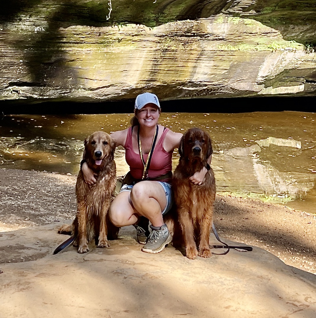 portrait of Leah and two golden retrievers